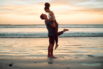 Image showing Happy couple at beach hug and love celebration on romantic sunset tropical ocean water hawaii luxury vacation travel or holiday. Woman and man dating and celebration for engagement announcement