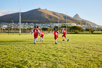 Image showing Girls, soccer team or fitness game on grass field in workout, training or exercise for game or match goals. Running, football or sports children, students or kids in energy competition at high school