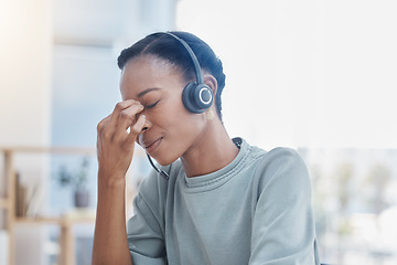 Image showing Stress, burnout and sad call center worker with a headache and office anxiety sitting in an office. Frustrated, sick or depression black woman customer service employee with pain or mental health