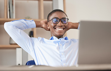 Image showing Black man, relax and laptop in office break, social media or web browsing after successful business deal. Leader, ceo or manager in Nigeria resting after writing email or planning finance strategy.