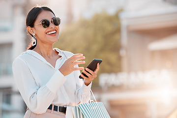 Image showing Fashion, shopping and bag with woman and phone for social media, sale and retail in New york city street. Luxury, customer and gift with girl and 5g for internet, communication or contact with mobile