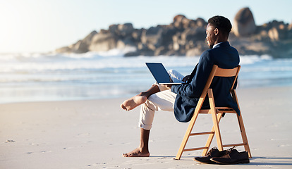 Image showing Beach, work and black man reading an email on a laptop with 5g internet while working by ocean. Relax, smile and happy African businessman doing remote business on a chair at the beach with computer