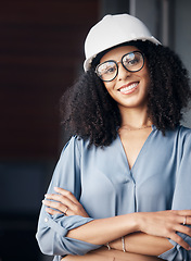 Image showing Engineer, technician and black woman with safety helmet, glasses and a smile while working in the construction, architect and engineering industry. Portrait of a happy female worker looking confident