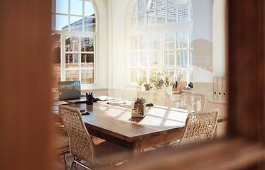 Image showing Interior, room and design with an empty home office in an office of a modern workplace during the day. Building, architecture and table in a corporate company for meeting or strategy after hours