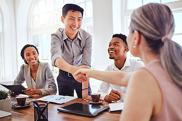 Image showing Handshake, meeting and business people happy with welcome to a corporate marketing company at work. Employees shaking hands for partnership deal, client collaboration and team support in an office