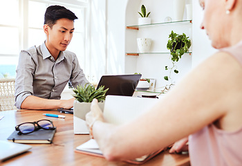 Image showing Man, asian and laptop at work in office with woman coworking in marketing, web design or advertising company. Workers, computer and desk with tech for information technology, strategy or planning