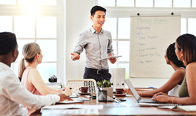 Image showing Asian, businessman and coach in team presentation for strategy, ideas and meeting discussion at the office. Japanese leader man talking to diverse group of employee workers in conference for startup