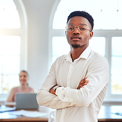 Image showing Business, leadership and portrait of black man in office with serious and assertive expression. Manager, ceo and businessman working in city. Startup idea, vision and team leader in modern workplace