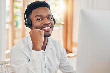 Image showing Black man, customer support service with a smile and working for digital call center or online telemarketing business. Crm consultant at office desk, helping client and consulting computer for fix