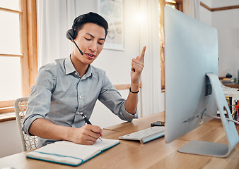 Image showing Customer support, telemarketing and writing with a man consultant doing remote work from his home office. Consulting, notebook and retail with an asian virtual assistant at work on a computer