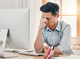 Image showing Headache, burnout and stress call center businessman with computer for information technology. Asian online IT support agent, virtual advisor or telemarketing worker tired, frustrated and depression