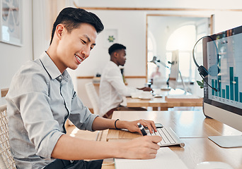 Image showing Call center, telemarketing and crm consultant writing sales report on infographics, Seo data and statistics on computer. Asian man with notebook for finance analytics, profit and performance notes