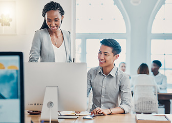 Image showing Employees, coworkers and training with computer doing research, speaking about project outcome and analysis at office desk. Smile, Asian man and black woman planning an online company strategy