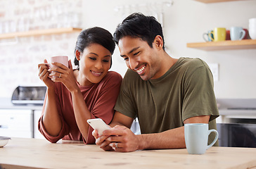 Image showing Phone, social media and couple with a man and woman in the kitchen of their home together in the morning. Mobile, coffee and communicaton with a married male and female reading a text in their house