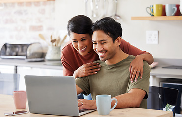 Image showing Laptop, internet and couple in communication on social media with coffee in the kitchen of their house. Man and woman with smile while reading an email on technology with drink of tea in the morning