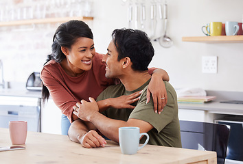 Image showing Couple love, happy and support or care conversation, hug and talking together at kitchen table. Married Asian man and woman affection or loving, healthy bonding and romantic smile at family house