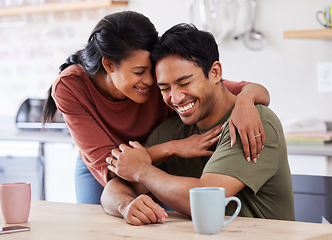 Image showing Couple, love and laugh with a man and woman hugging, laughing or having fun in the kitchen of their home together. Happy, smile and humor with a married male and female embracing in their house