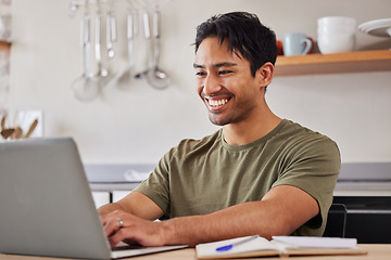 Image showing Internet, technology and man kitchen with laptop, happy freelance worker from India. Startup work from home, Indian businessman with smile doing online research and typing on computer with notebook.