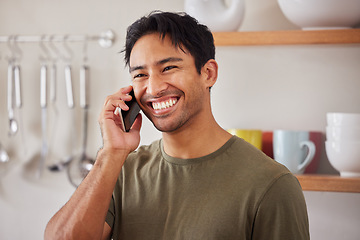 Image showing Happy man, phone call and communication in home kitchen for conversation, connection and talking in Colombia. Smile young guy speaking on smartphone, cellphone discussion and mobile technology hello
