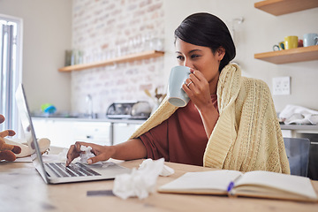 Image showing Working from home, a woman sick with covid virus or flu and doing business email with laptop on the kitchen table. Remote office work, online employee has tea and blanket to stay warm in poor health