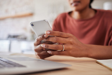 Image showing Woman, hands and phone for business startup working on table chatting, texting or social media at home. Hand of a freelancer in remote work and browsing mobile smartphone in communication by desk