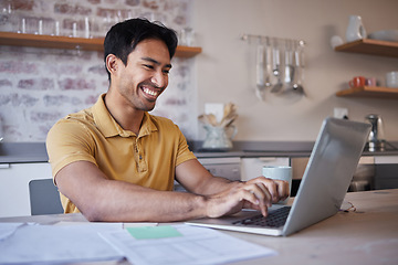 Image showing Man, working on report from home or use laptop for internet search at his kitchen table. Asian with smile, happy typing online and in communication on social media, email or freelance work.