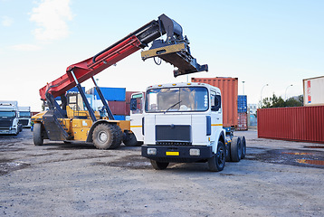 Image showing Truck, logistics and supply chain with a construction driver on a commercial container yard for shipping or distribution. Storage, stock and cargo with a vehicle in the import and export industry