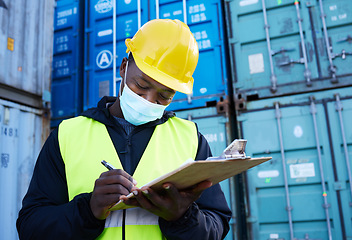 Image showing Logistics worker, container port and covid, black man writing on inventory checklist. Cargo yard, export and safety for shipping port employee or inspector with clipboard at global freight company.