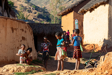 Image showing Morning ritual in Lakanga village as Malagasy girls fetch water for cooking. Andringitra mountain, Madagascar