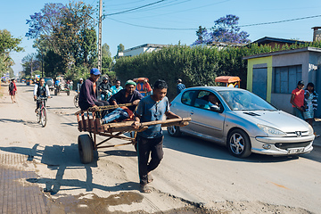 Image showing Traditional rickshaw on the Antsirabe city streets. Rickshaws are a common mode of transport in Madagascar.