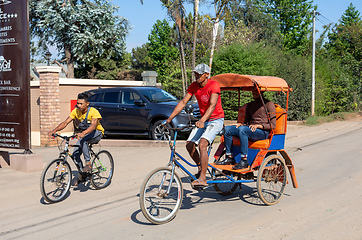 Image showing Traditional rickshaw on the Antsirabe city streets. Rickshaws are a common mode of transport in Madagascar.