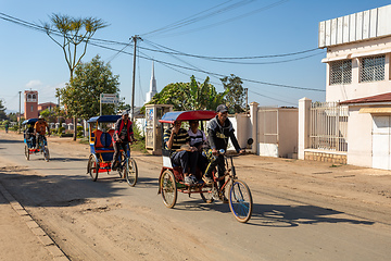 Image showing Traditional rickshaw on the Antsirabe city streets. Rickshaws are a common mode of transport in Madagascar.