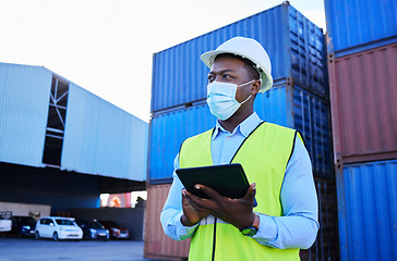 Image showing Man, logistics worker, and covid with a tablet to check inventory in mask with cargo container in background. Black industry employee working, shipping and health and safety at work site.