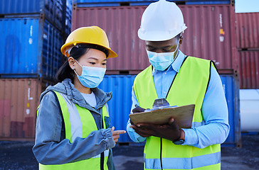 Image showing Covid, documents and supply chain logistics with a team working in shipping on a commercial container dock. Teamwork, freight and cargo with a man and woman courier filling out an order or shipment
