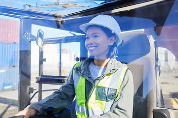 Image showing Logistics, supply chain and transport with a woman shipping worker driving a vehicle on a commercial container dock. Freight, cargo and stock with an asian female courier working in a storage yard