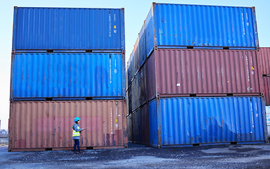 Image showing Logistics, supply chain and woman in container port checking inventory list for global freight company. Industrial shipping yard, female inspector counting cargo stack for delivery in storage area.