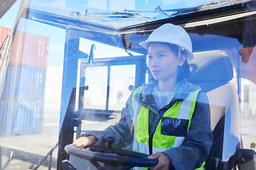 Image showing Asian woman, logistics and machine for industry shipping at work for transportation in container yard. An engineer working in industrial warehouse with transport machinery for cargo shipment