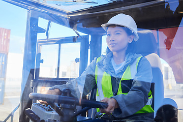 Image showing Supply chain, logistics and transport with a woman shipping worker driving a vehicle on a commercial container dock. Freight, cargo and stock with an asian female courier at work in the export trade