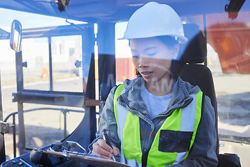 Image showing Shipping, documents and transport with a woman logistics expert working in the supply chain or export industry. Freight, cargo and stock with an asian courier at work in a storage or container yard