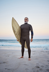 Image showing Senior man on beach, summer surfing vacation and holiday travel fitness adventure on Australia shore. Sunset sky with confident elderly surfer holding surf board and healthy retirement sea exercise