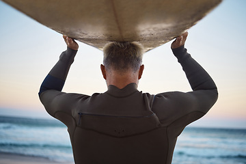 Image showing Surfer with surfboard before surfing and sea waves in nature outdoor, extreme sports or adrenaline activity. Back of sporty man walking to a ocean beach water in summer for surf training on vacation