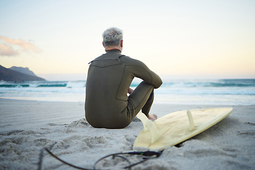 Image showing Beach, waves and surfer on surfing holiday in Hawaii to relax in peace on the sand by the ocean in nature. Back of man thinking of travel vacation with board for adventure in the calm summer water