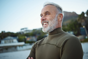 Image showing Surf, happy and senior man at the beach for peace, calm or freedom of the mind during holiday in Rio de Janeiro Brazil. Wetsuit, retirement sports and elderly person relax before surfing for wellness