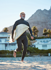 Image showing Beach, mature surfer running with surf board on sea sand and weekend water sports. Freedom, fitness and fun summer retirement holiday in Australia. Health, wellness and senior man on surfing vacation