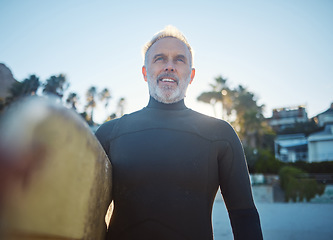 Image showing Beach, surfer and old man at sea ready to start surfing on summer holiday vacation in his retirement in Hawaii. Freedom, ocean and senior man with surfboard feeling confident, excited and happy