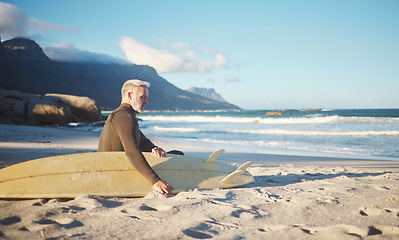 Image showing Surf, relax and senior man on the beach for sports, surfing and fun exercise for health, wellness and ocean sea freedom. Peace, sand and surfer chill after fitness or surf board training in Portugal