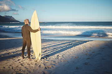 Image showing Beach, board and man surfing on holiday in the summer water of Brazil during retirement freedom. Back of mature surfer on travel vacation by the ocean on an island for the waves with his surfboard