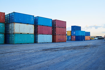 Image showing Container, logistics and port at storage in shipyard for global supply chain on sea. Shipping, cargo and transport distribution of goods, for import and export at international harbour