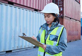 Image showing Logistics, shipping and asian woman engineer writing checklist report for inspection or delivery control of cargo containers at shipyard. Supply chain worker in safety helmet at a warehouse in Korea