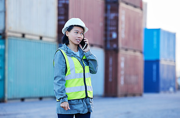 Image showing Logistics, phone call and woman talking about shipping container on a phone while working at port. Asian insdustrial employee speaking about distribution of cargo and stock on a mobile at a warehouse